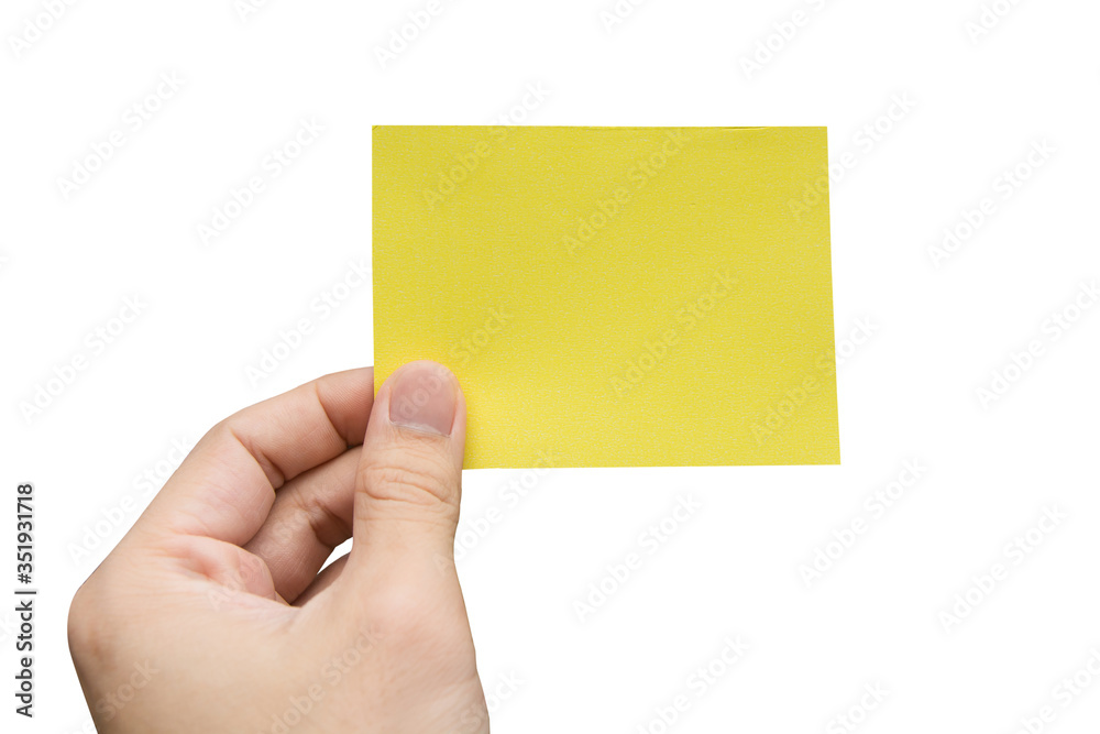 Hand holding yellow paper isolated on white with clipping path. Hand holding yellow paper isolated on white with clipping path.