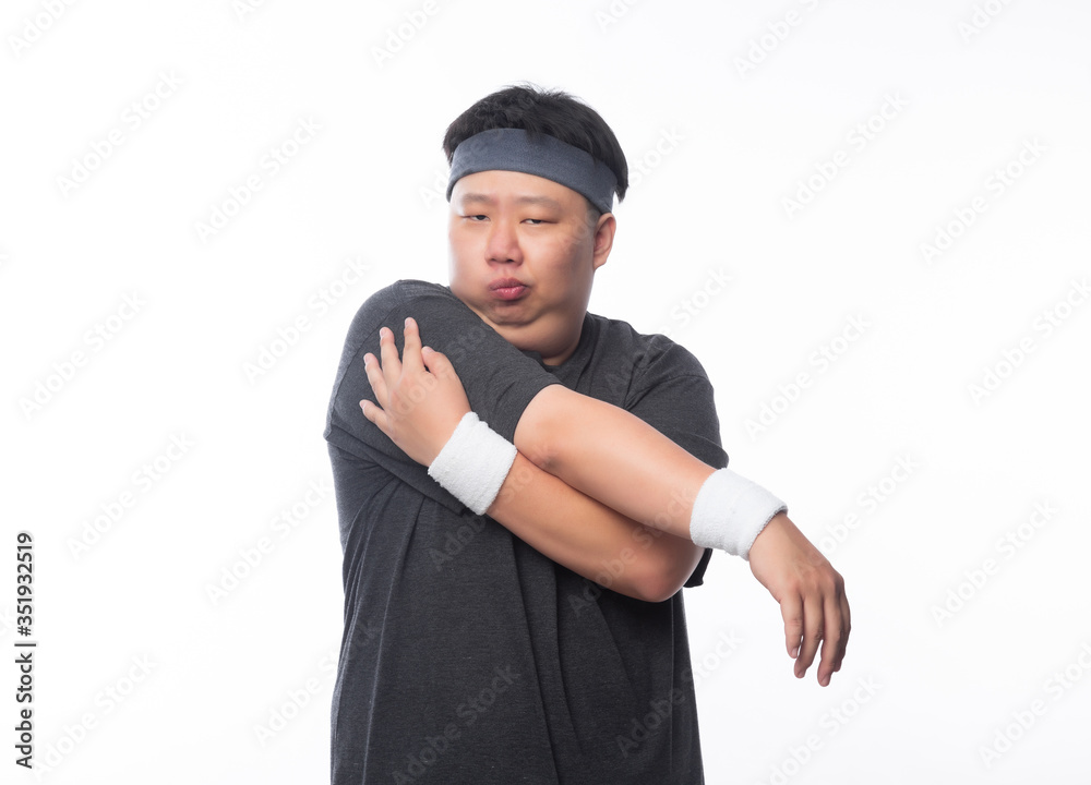 Young Asian funny fat sport man stretching before exercise isolated on white background. Young Asian funny fat sport man stretching before exercise isolated on white background.