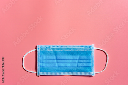 Medical mask on pink background Covid 19 protection. With clipping path.