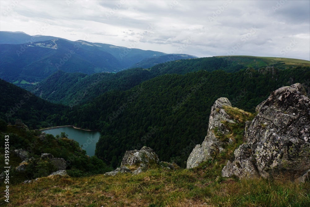 Top view on lake Schiessrothried with hilly landscape of the Vosges