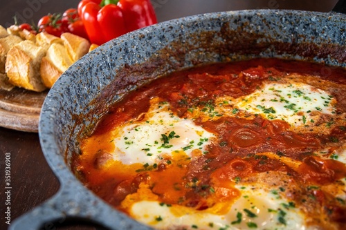 shakshuka middle east traditional breakfast meal with eggs in a pan