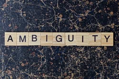 Fotografia text the word ambiguity from gray wooden small letters with black font