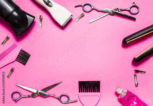 hairdressing accessories on a pink background look from above, mock up, nobody