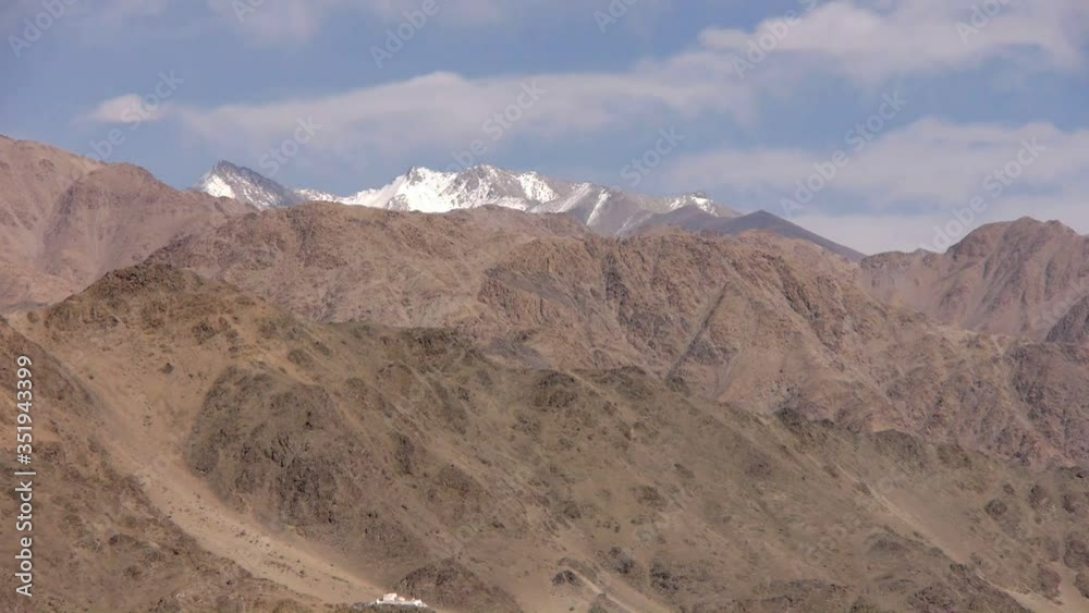 Panorama of the Himalayan snowing ranges surrounding the lifeless plain in Ladakh Panorama of the Himalayan snowing ranges surrounding the lifeless plain in Ladakh