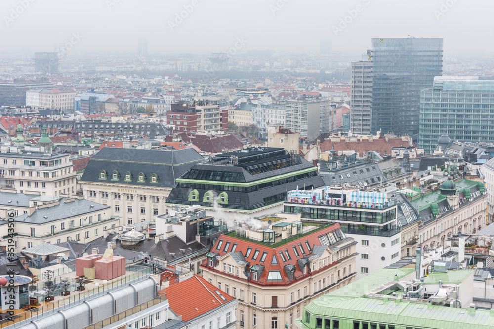 Cityscape of the old town of Vienna in a heavy snowy day.  View at the tower of St. Stephen's Cathedral in Vienna, Austria.