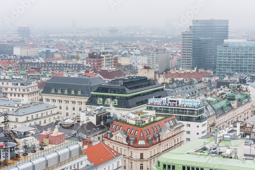 Cityscape of the old town of Vienna in a heavy snowy day.  View at the tower of St. Stephen's Cathedral in Vienna, Austria. © zz3701