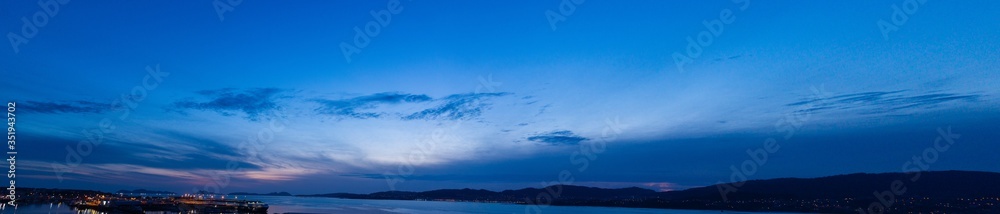 Panoramic night sky with some clouds