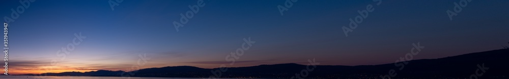 Panoramic night sky with some clouds