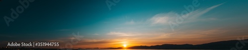 Panoramic sunset sky full of clouds