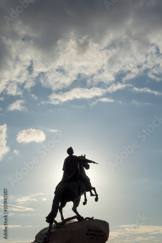 Silhouette of an equestrian monument against a dramatict sky