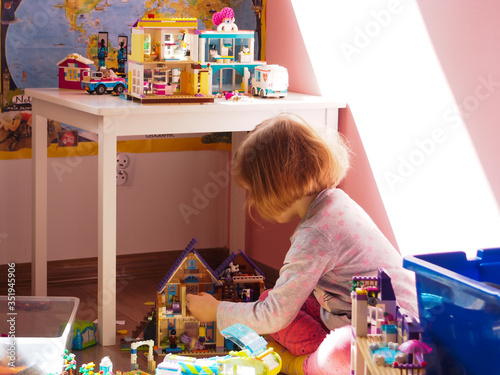 the girl is playing with blocks