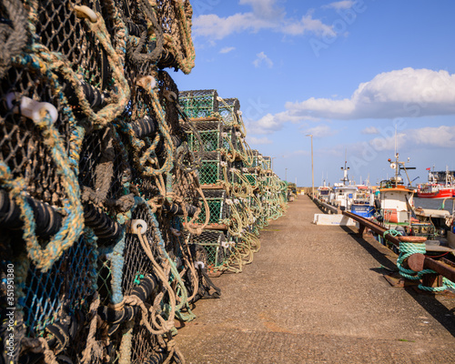 Lobster and Crab pots stacked on the quayside