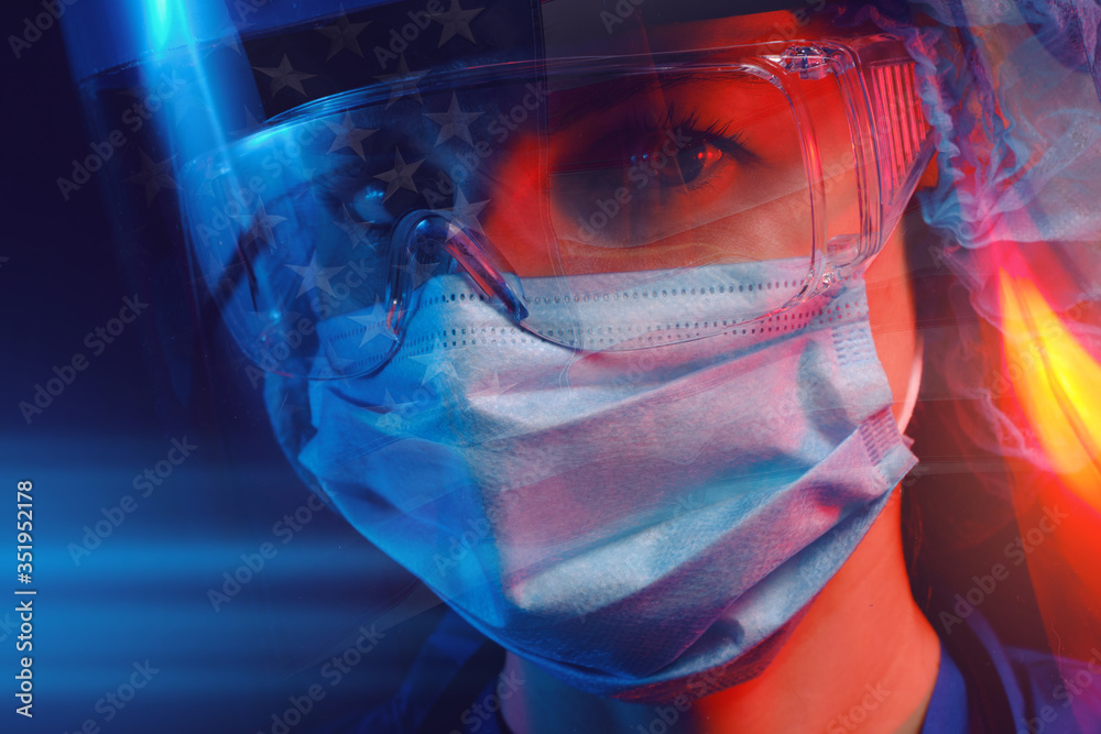 female american doctor in medical mask on the face and gloves on a dark background