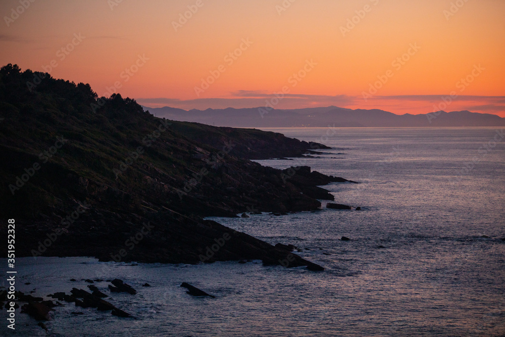 Sunset in the basque coast under Jaizkibel mountain in Hondarribia, Basque Country.