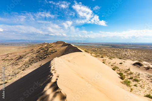 Fototapeta Naklejka Na Ścianę i Meble -  Sand dune blue skies in sunny day
