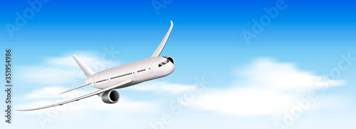 Airplane flies above the clouds. Airplane on a background of blue sky and white clouds. A plane flying in the sky