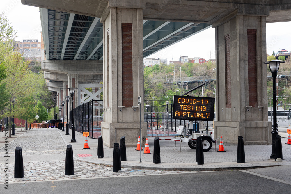 Hoboken, NJ/USA - May 4th 2020 : Sign for Coronavirus drive through testing site under the viaduct