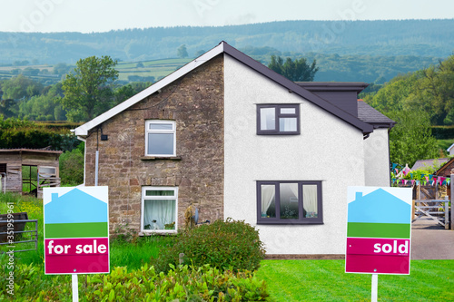 Property Sales UK. Estate Agents For Sale and Sold Signs on semi detached Houses. Visual to show benefits of property maintenance for house sales. Contrast of run down versus well maintained property