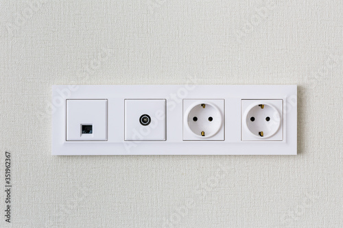 TV, Internet, Euro sockets for connecting smart and satellite TV on the background of a light wall