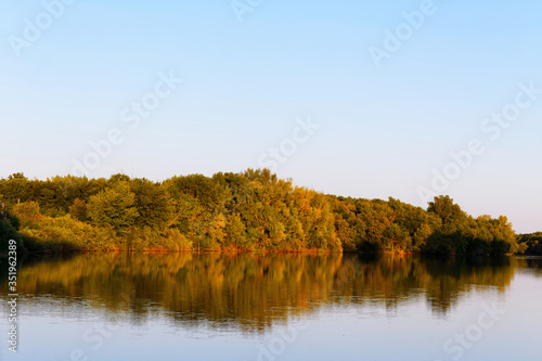 Beautiful river landscape. The Bolshoi Irgiz River, Saratov Region. Sunset on the river.