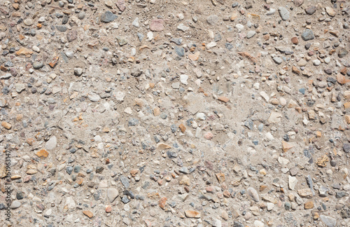 Concrete surface with small stones for background.