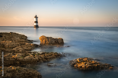 Penmon Point Lighthouse, Beaumaris Anglesey in the dramatic landscapes of scenic Wales, fantastic adventure travel destination or holiday vacation to view picturesque scenery at sunrise or sunset