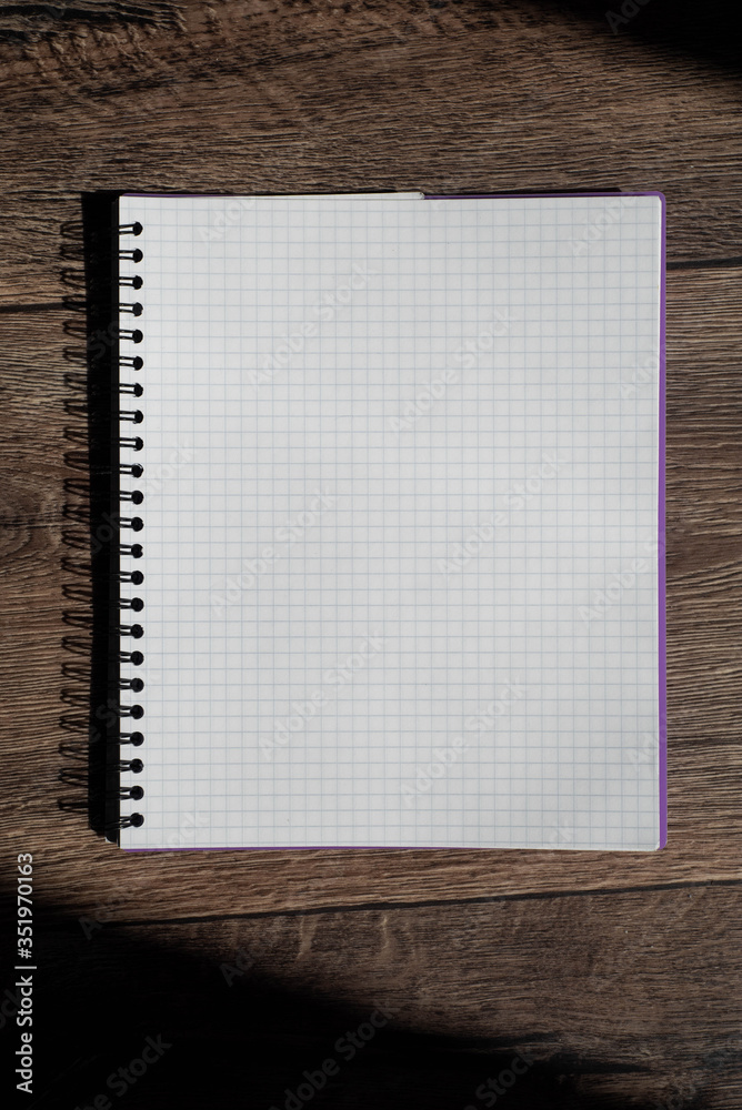 notebook on wood background notebook on wood background