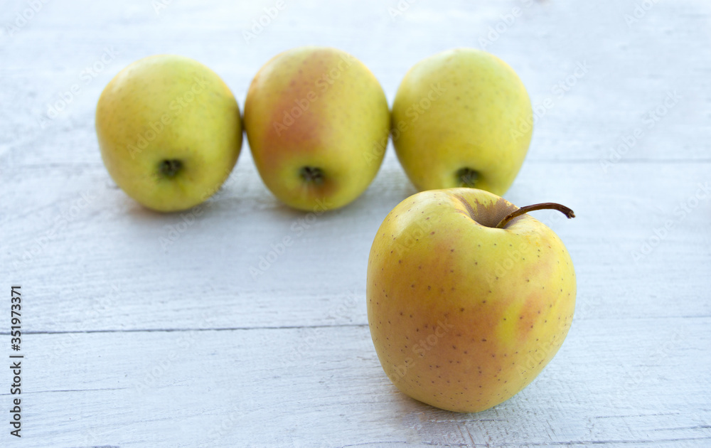 Emoji concept. Smiling fruit face. Yellow apples for eyes and a yellow banana for a smile on white background. Emoji concept. Smiling fruit face. Yellow apples for eyes and a yellow banana for a smile on white background.