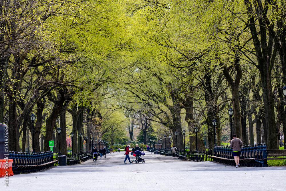 Manhattan, NY, USA- 4/17/20: people during the time of coronavirus in Central park