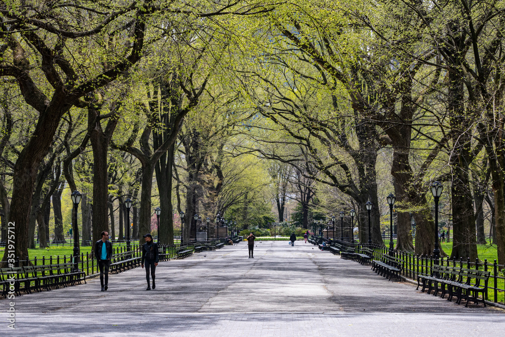 Manhattan, NY, USA- 4/17/20: people during the time of coronavirus in Central park