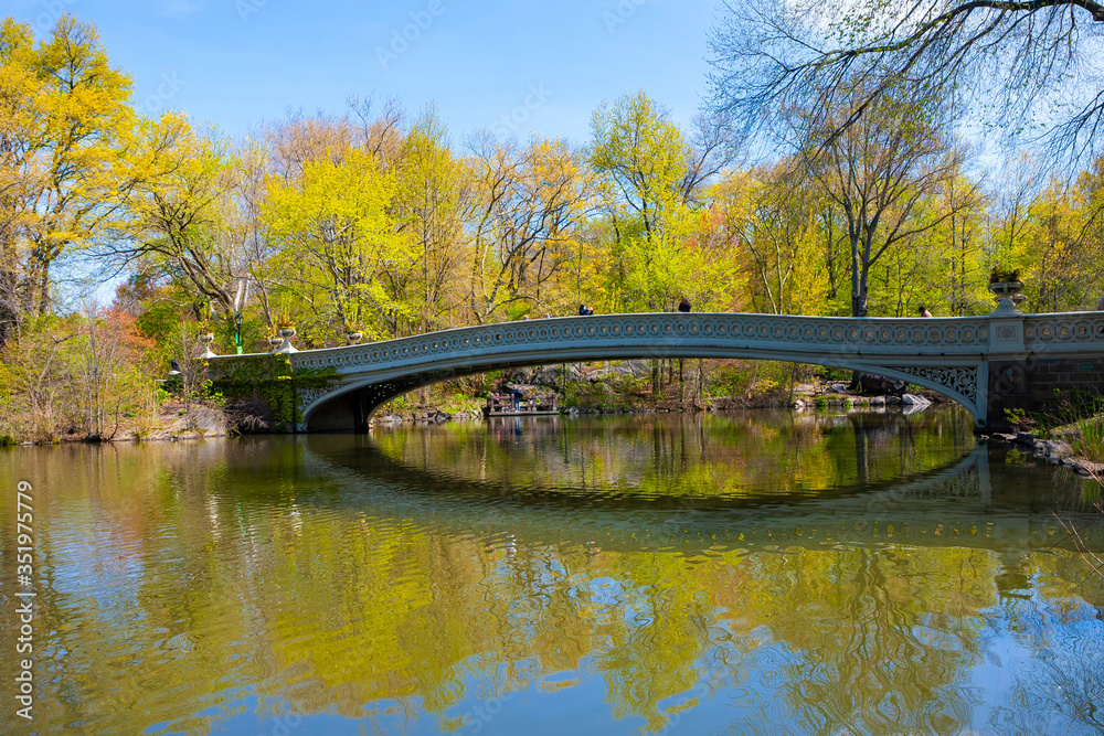 Bow bridge in Central park at spring sunny day. Manhattan