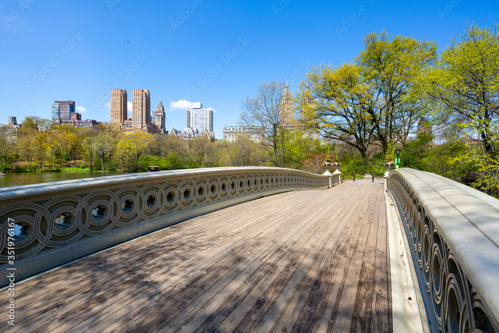 Fototapeta premium Bow bridge in Central park at spring sunny day. Manhattan