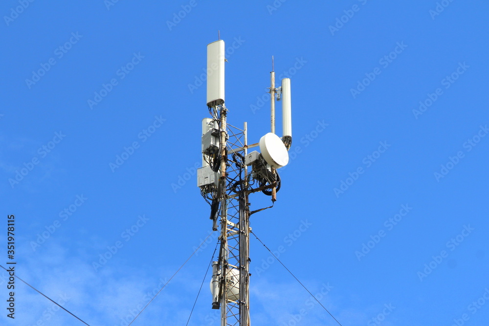 Base station mobile network antenna on a steel structure mast with a repeater. 3g, 4g, 5g.
