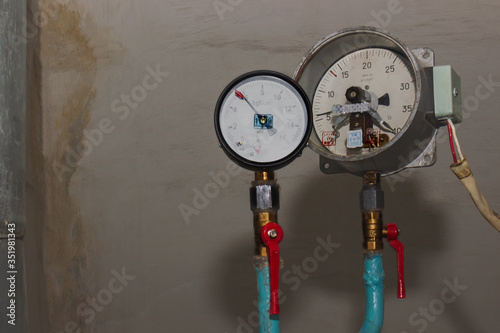 Manometer, measuring water pressure. Pressure Gauge, Measuring Instrument Close Up on Hot Water, Oil or Gas Pipeline.