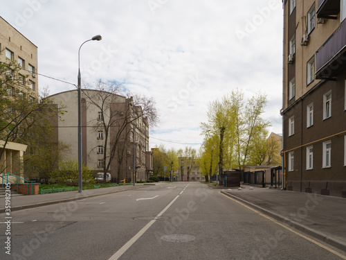 Moscow cityscpe in coronavirus pandemic. Narrow road. No people and traffic in the city center. Quarantine. Everybody stay  home. Coronavirus pandemic lifestyle. photo