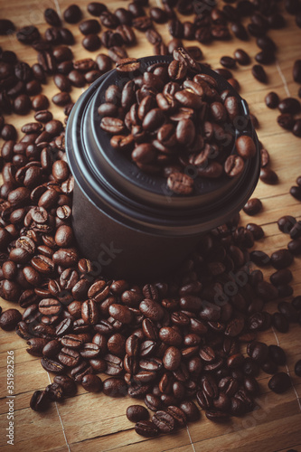 blurry grains of coffee around a mug