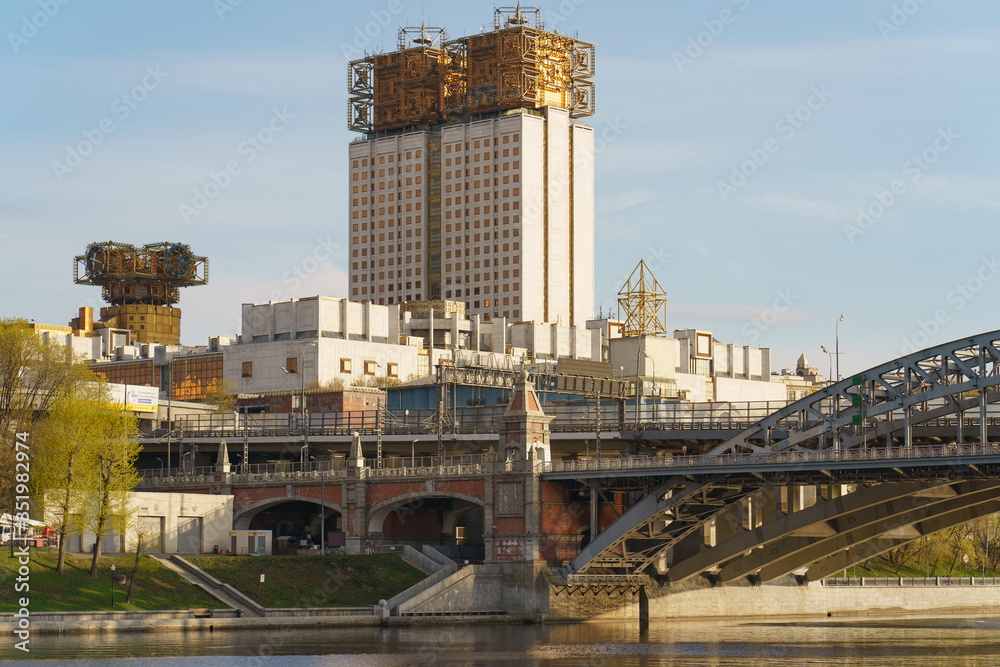 Moscow cityscape in the spring day. Industrial landscape. Calmness. Coronavirus pandemic time. No people.  Top of the Academy of sciences and railroad bridge.