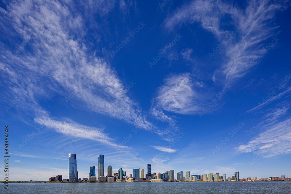 Jersey City skyline with skyscrapers over Hudson River viewed from New York City Manhattan downtown
