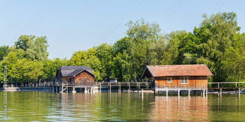 Wooden boat houses at Ammersee (Lake Ammer) duing springtime
