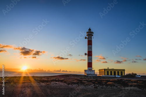 Dawn on the island of Tenerife. Lighthouse on the Atlantic. Canary Islands