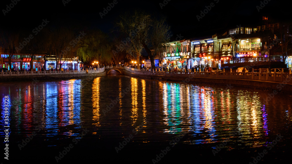 Shichahai Lake, night view of colorfully lit buildings on the shores of the lake.