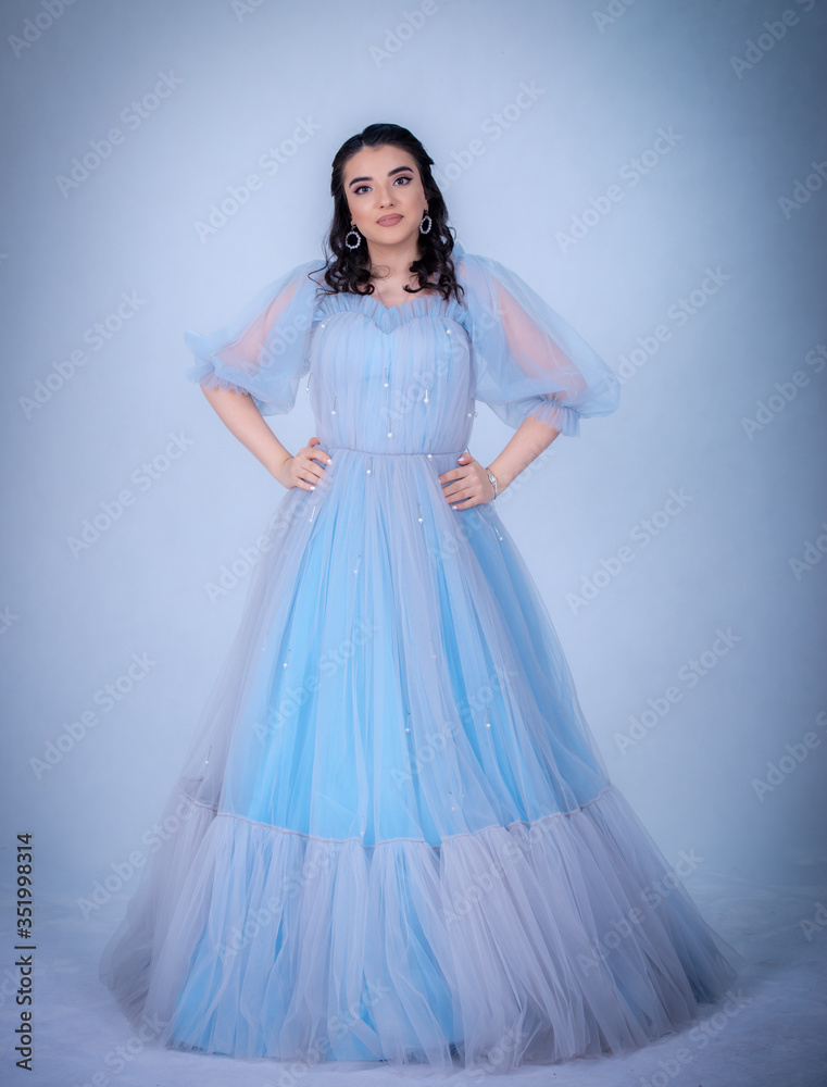 Fototapeta premium young beautiful model in the image of princesse ,cinderella dressed in a blue dress