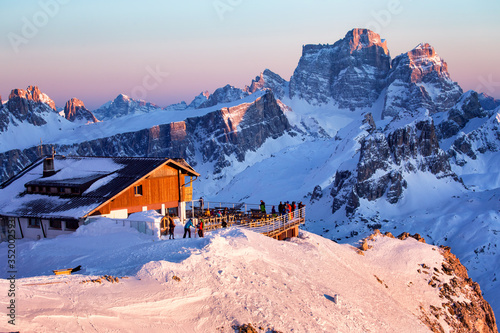 Fototapeta Rifugio Lagazuoi and Cable car station against the background of the Dolomites at sunset