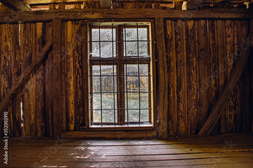 old wooden window, view from inside an old abandoned house