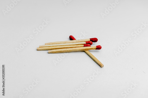 A close up shot of a match that was stacked in a white background