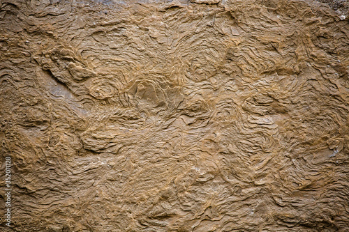 Vintage layered brick texture. Exfoliating texture of an old building stone. Super close up shot. Background concept