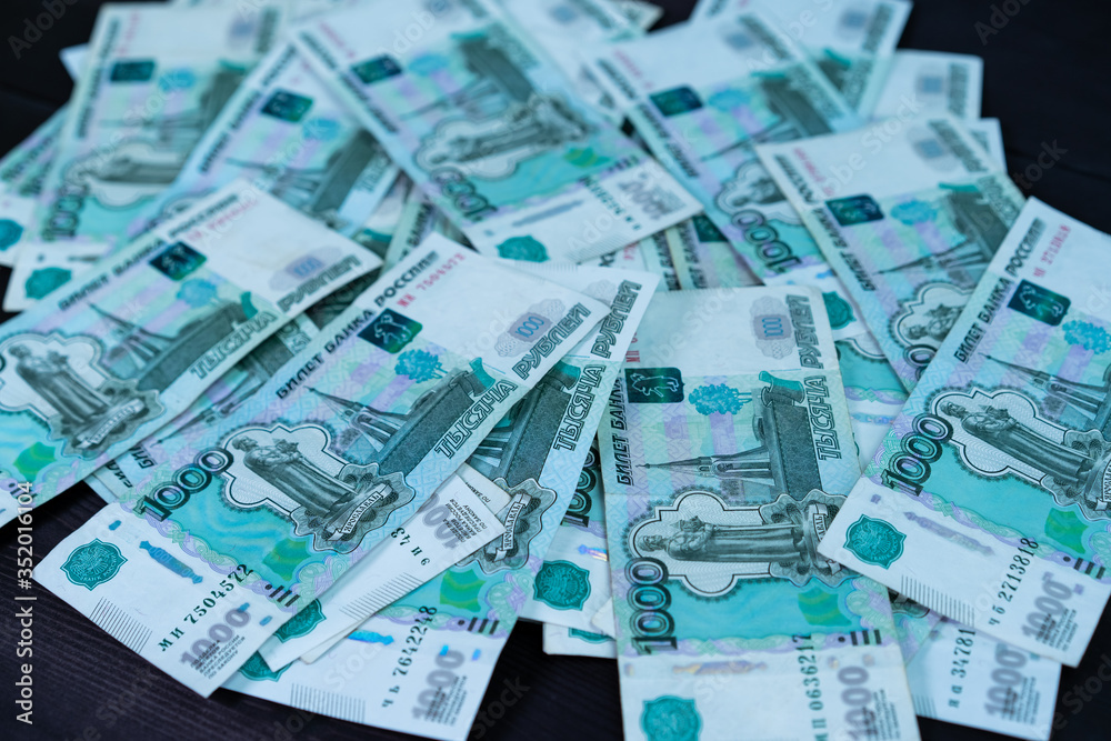 Bundle of money on wooden background Bundle of money on wooden background