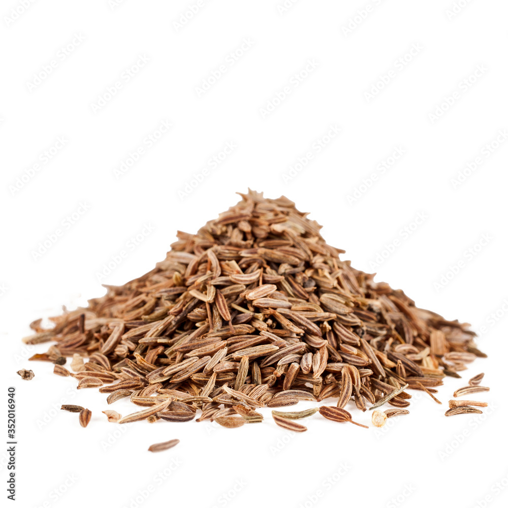 Heap of caraway seeds isolated on a white background. Heap of caraway seeds isolated on a white background.