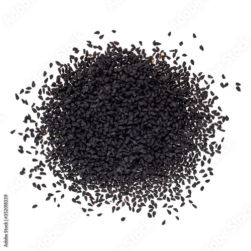 Black caraway or Nigella sativa. Heap isolated on a white background. Top view.