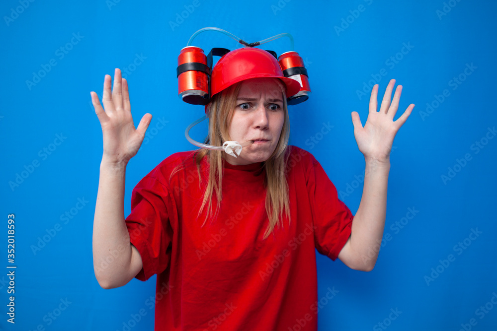 alarmed girl a fan in red uniform drinks beer and cheers for the team, a cheerleader watches the game and is worried alarmed girl a fan in red uniform drinks beer and cheers for the team, a cheerleader watches the game and is worried